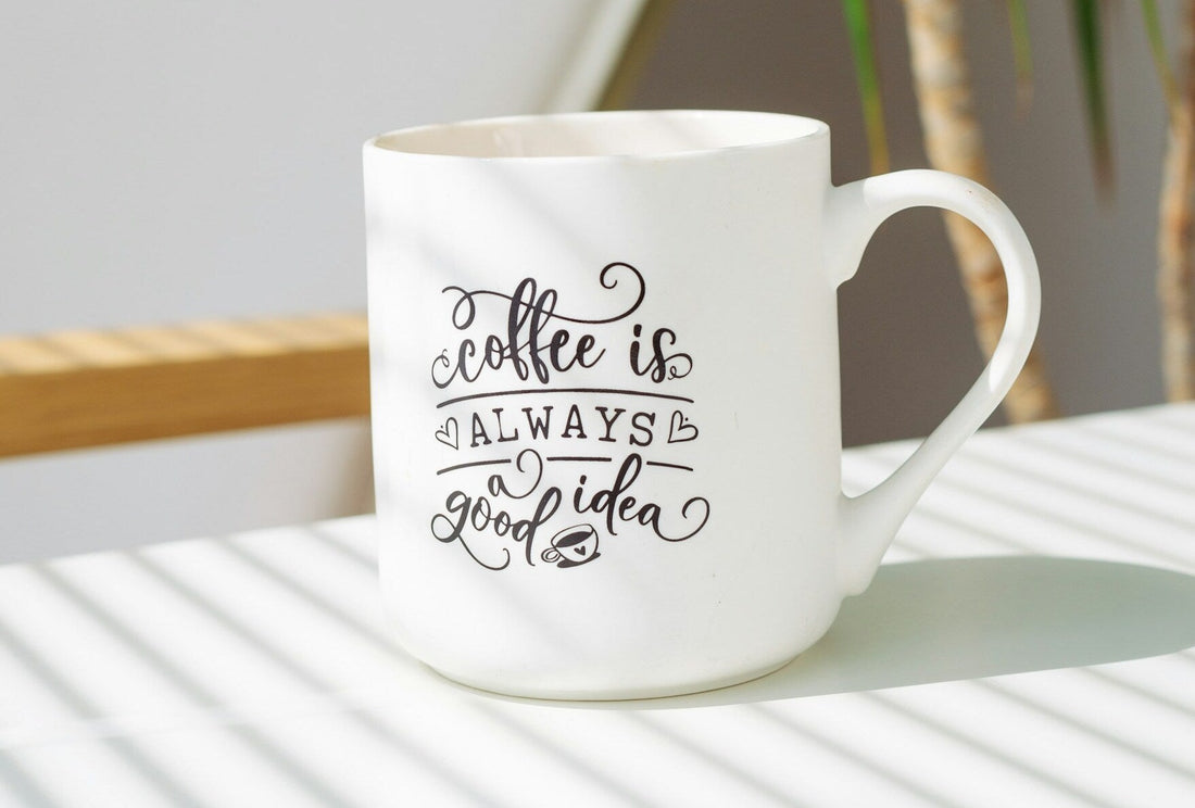 White ceramic mug with text design